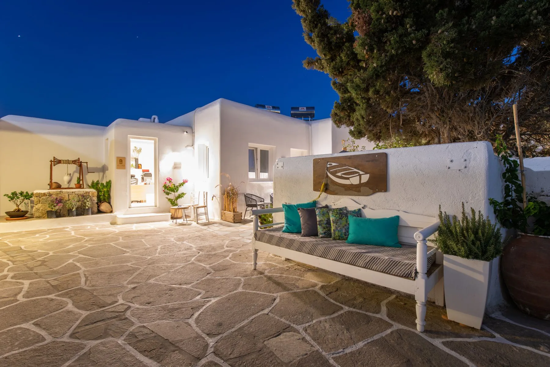 Courtyard lounge with cushions at dusk